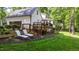 Charming home exterior with a two-car garage, a spacious deck, and landscaped garden, perfect for outdoor relaxation at 202 Homestead Dr, Cary, NC 27513