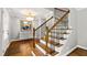 Welcoming foyer with a staircase, chandelier, and elegant decor at 202 Homestead Dr, Cary, NC 27513