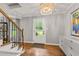 Bright foyer with hardwood floors, a chandelier, and stylish decor at 202 Homestead Dr, Cary, NC 27513
