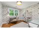 Stylish home office with patterned wallpaper, hardwood flooring, and ample natural light at 202 Homestead Dr, Cary, NC 27513