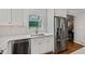 Modern kitchen featuring stainless steel appliances, white cabinetry, and natural light at 202 Homestead Dr, Cary, NC 27513