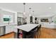 Spacious kitchen featuring a large island, stainless steel appliances, and hardwood floors at 202 Homestead Dr, Cary, NC 27513