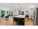 Modern kitchen with a large island, stainless steel appliances, and barstool seating at 202 Homestead Dr, Cary, NC 27513