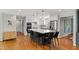 Open-concept kitchen featuring an oversized island with seating and modern appliances at 202 Homestead Dr, Cary, NC 27513