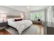 Calm main bedroom featuring a large window and neutral decor at 202 Homestead Dr, Cary, NC 27513