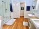Well-lit bathroom features a glass shower, ample counter space, and charming decor, creating a pleasant retreat at 204 N Elliott Rd, Chapel Hill, NC 27514
