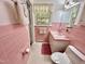 Bathroom featuring a pink tile, a vanity, and built in shelving with a vintage design at 204 N Elliott Rd, Chapel Hill, NC 27514