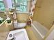 Retro-style bathroom showcasing yellow tile, a tub-shower combo, and well-maintained fixtures at 204 N Elliott Rd, Chapel Hill, NC 27514