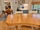 Charming dining area with an expansive kitchen view and a wooden table with chairs at 204 N Elliott Rd, Chapel Hill, NC 27514