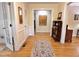 Bright hallway featuring hardwood floors, white trim, and view to other rooms in the home at 204 N Elliott Rd, Chapel Hill, NC 27514