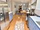 Spacious kitchen featuring stainless steel appliances, light blue cabinets, and an open layout leading to dining at 204 N Elliott Rd, Chapel Hill, NC 27514