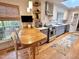 Modern kitchen with a breakfast bar, stainless steel appliances, and ample natural light from the window at 204 N Elliott Rd, Chapel Hill, NC 27514