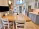 Bright kitchen boasting a breakfast bar, modern appliances, and ample natural light from the overhead skylight at 204 N Elliott Rd, Chapel Hill, NC 27514