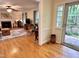 Living Room with hardwood floors, traditional fireplace, and door to backyard at 204 N Elliott Rd, Chapel Hill, NC 27514