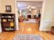 Open floor plan displaying the living room with hardwood floors, fireplace, and natural light at 204 N Elliott Rd, Chapel Hill, NC 27514