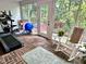Bright sunroom with exercise equipment and a view of the outdoors, perfect for fitness and relaxation at 204 N Elliott Rd, Chapel Hill, NC 27514