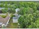 Suburban home boasts mature trees and a well-maintained lawn in an established neighborhood at 206 Wagon Trail Dr, Cary, NC 27513