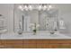 A large bathroom mirror reflects the double sink vanity and the shower stall in the background at 206 Wagon Trail Dr, Cary, NC 27513