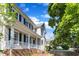 Charming two-story home featuring a welcoming front porch and blue shutters at 206 Wagon Trail Dr, Cary, NC 27513