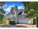 Two story home with a two car garage and basketball hoop in the driveway at 206 Wagon Trail Dr, Cary, NC 27513