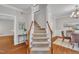 Inviting foyer with hardwood floors and staircase leading to the upper level at 206 Wagon Trail Dr, Cary, NC 27513