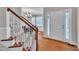 Bright foyer with hardwood floors and stairs at 206 Wagon Trail Dr, Cary, NC 27513