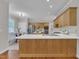 Bright kitchen featuring light wood cabinetry, stainless steel appliances, and a breakfast nook with plenty of natural light at 206 Wagon Trail Dr, Cary, NC 27513