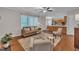 Cozy living room with neutral colors, natural light, and a view of an adjacent kitchen for easy entertaining and relaxing at 206 Wagon Trail Dr, Cary, NC 27513
