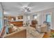Open-concept living area seamlessly connects to a kitchen with stainless steel appliances, perfect for modern living and entertaining at 206 Wagon Trail Dr, Cary, NC 27513