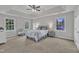 Spacious main bedroom with tray ceiling, neutral tones, and ample natural light at 206 Wagon Trail Dr, Cary, NC 27513