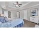 Well-lit main bedroom with a tray ceiling, multiple windows, and neutral-colored walls at 206 Wagon Trail Dr, Cary, NC 27513