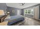 A nicely-decorated bedroom with a ceiling fan and a window that provides plenty of natural light at 209 Brookberry Rd, Holly Springs, NC 27540