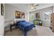 Bright bedroom with natural light from the window, and a ceiling fan for added comfort at 209 Brookberry Rd, Holly Springs, NC 27540