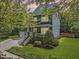 Charming two-story home with a well-manicured lawn and inviting front porch at 209 Brookberry Rd, Holly Springs, NC 27540