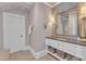 Stylish bathroom with modern vanity, custom mirror, and elegant decor at 2117 Buckingham Rd, Raleigh, NC 27607