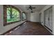 Spacious covered patio with stone arches, ceiling fans, and views of the landscaped backyard at 2117 Buckingham Rd, Raleigh, NC 27607