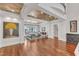 Elegant dining room featuring tray ceiling, hardwood floors, and French doors to outdoor area at 2117 Buckingham Rd, Raleigh, NC 27607