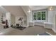 Bright home exercise room featuring ample natural light, exercise equipment, and comfortable carpet at 2117 Buckingham Rd, Raleigh, NC 27607