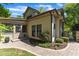 Home exterior with brick pathway, charming landscaping, and a screened-in porch at 2117 Buckingham Rd, Raleigh, NC 27607