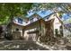Charming home exterior with a three-car garage, stone accents, and well-maintained landscaping at 2117 Buckingham Rd, Raleigh, NC 27607