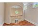 Arched foyer with decorative chandelier, white walls, and windows letting in ample natural light at 2117 Buckingham Rd, Raleigh, NC 27607