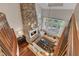 Spacious living room with stone fireplace, hardwood floors, large windows, and classic furnishings at 2117 Buckingham Rd, Raleigh, NC 27607