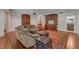 Inviting living room with hardwood floors, custom cabinets, and comfortable seating on a patterned rug at 2117 Buckingham Rd, Raleigh, NC 27607