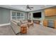 Relax in this living room with a wet bar, plush seating, and a ceiling fan for added comfort at 2117 Buckingham Rd, Raleigh, NC 27607
