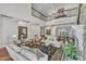 Luxurious living room featuring a balcony, fireplace, hardwood floors, and open floor plan at 2117 Buckingham Rd, Raleigh, NC 27607