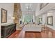 Elegant living room with stone fireplace, hardwood floors, and lots of natural light at 2117 Buckingham Rd, Raleigh, NC 27607
