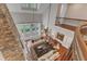 Bright living room features stone fireplace, hardwood floors, large windows, and stylish, neutral furniture at 2117 Buckingham Rd, Raleigh, NC 27607
