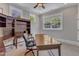 Bright office with hardwood floors, neutral paint, and large windows providing ample natural light at 2117 Buckingham Rd, Raleigh, NC 27607