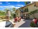 Outdoor patio features brick pavers, outdoor fireplace, seating and dining areas, and lush landscaping at 2117 Buckingham Rd, Raleigh, NC 27607