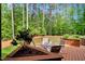Enjoy outdoor relaxation on the spacious back deck, surrounded by lush greenery and mature trees at 2201 Avinshire Pl, Wake Forest, NC 27587